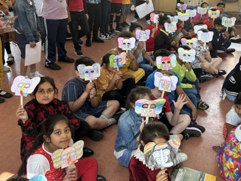 Children displaying Spanish style masks